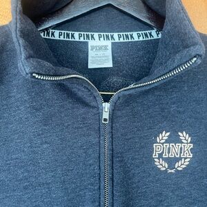 T.  Victoria’s Secrets Gray Zip-Up Sweatshirt/Leggings with Gold Logo
On both.